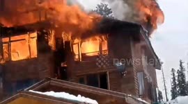 Residents throw snowballs at burning hotel in Indian ski resort