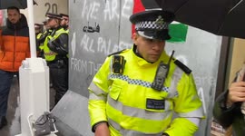 Pro-Palestine protesters erect a border wall outside Axa insurance offices in London