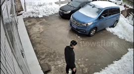 Man has lucky escape as he narrowly avoids being crushed by huge snowfall