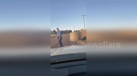 Officer Removes Large Round Bale from Road for Traffic Safety in Missouri, USA