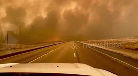 Dramatic footage shows firefighters driving through wildfire as they arrive to fight Smokehouse Creek Fire