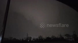 Terrifying tornado strikes Aurora, Illinois, illuminated by lightning