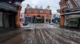 Dublin Covered in Snow, Pedestrians Navigate Dirty Sidewalks