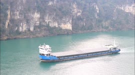 Cargo ships pass through the Three Gorges of the Yangtze River in Yichang, China