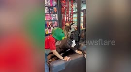 English Mastiff pooch has hilariously scared reaction to green fish mask