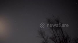 Newest SpaceX Starlink satellite train group G6-40 seen in Switzerland flying over the Moon