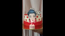 Cake with pin up girl blowing the candle for her birthday. New cake trend