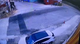 Container truck overturns and flattens parked car in Hong Kong