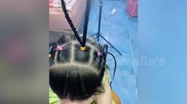 Mother spells out 'LOVE' with awesome hair style for daughter
