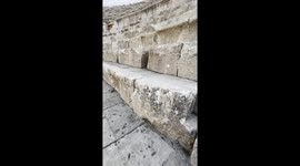 Climbing on the Roman Theater in Jerash archeological site, Jordan. Jerash is an ancient city located in Jordan that dates back to the Greco-Roman period. It is one of the best-preserved Roman cities in the world.