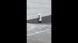 Woman struggling to climb icy slope ultimately slips to bottom in China