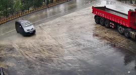 Several vehicles skid uphill and almost crash outside shop in rainy conditions