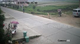 An elderly man in a wheelchair avoids a crash in Hunan, China