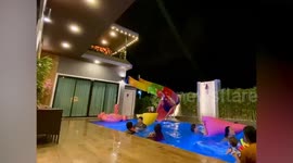 Shooting star illuminates night sky as family play in swimming pool