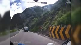 Terrifying moment huge boulders crush vehicles in Peru