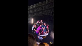 Coldplay singer Chris Martin greets pregnant fan and her dancing friend at concert