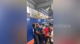 Commuters squeeze into crowded train in the Philippines