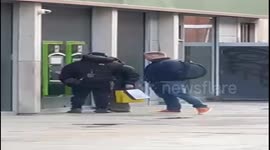 VIDEO: Shocking moment woman has large wad of cash stolen from her at ATM before passerby intervenes and chases crook (Part 2)