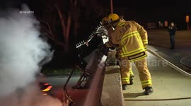 Tesla Drives Off Overpass Onto Busy Freeway Catches Fire in Los Angeles, USA
