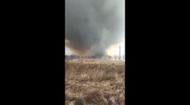 Fire tornado menaces homes in Russia
