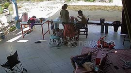 Youngsters leap up to chase toddler on walker as he rolls away on front porch