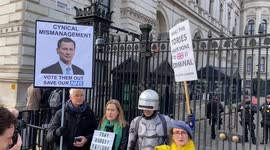 Anti-Tory Protesters joined by RoboCop on Budget Day outside Downing St