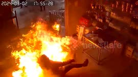 Woman's heroic effort to extinguish kitchen fire turns into heart-stopping moment