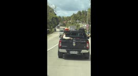Headless passenger rides in pickup truck... but it's actually a bizarre illusion