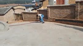 Woman enthusiastically lit a firecracker in Yunnan, China