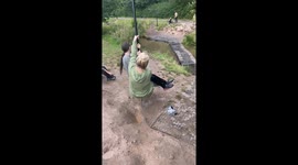 Woman Falls Into Stream While Trying to Get Off Swing