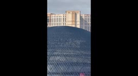 Guy Stands on Top of the Sphere in Las Vegas