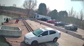 Parked car slides into fish pond