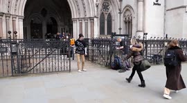 Climate activists glue themselves to Royal Courts of Justice in London