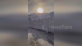 Golden Sunrise Over Snowy Landscape in California, USA