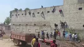 Relatives climb school walls to hand cheat sheets to pupils taking exams
