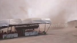 Raging dust devil tornado blows over marquees in Thailand