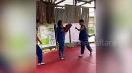 Muay Thai boxer accidentally high-kicks coach in face during practice