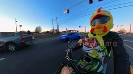 Motorcyclist Hands Out Flowers on Valentine's Day