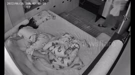 Heartfelt Farewell Kiss: A Family's Morning Ritual in China