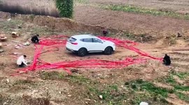 Locals light firecrackers around brand-new car to celebrate purchase