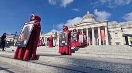 British-Iranian women in Handmaid's Tale outfits continue to relay powerful message on International Women's Day in London