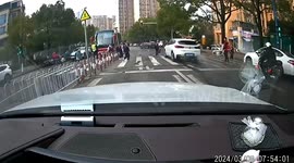 BMW driver running red light strikes crowd in southern China, injuring 2