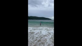 Brazilian grandma takes a wavy tumble in Rio!