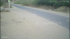 Dramatic CCTV shows a jeep  full with people overturned on middle of the road