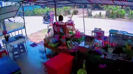 Storm blows shop's metal awning onto woman in Thailand