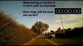 A slow Cyclist holding up a vehicle. What will the driver do?