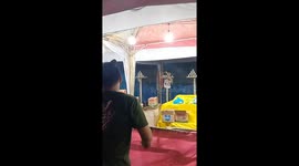 Carnival Game Player Falls Over Railing