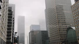 Londoners make the most of a bad day in pool boats in the London Docklands