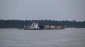 Bulk carrier ship carrying cargo up the Mackenzie River in northern Canada to service remote communities