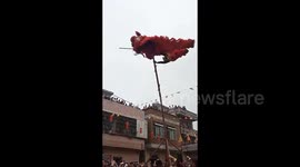 Terrifying moment lion dancer falls from 5-metre pole during performance in China